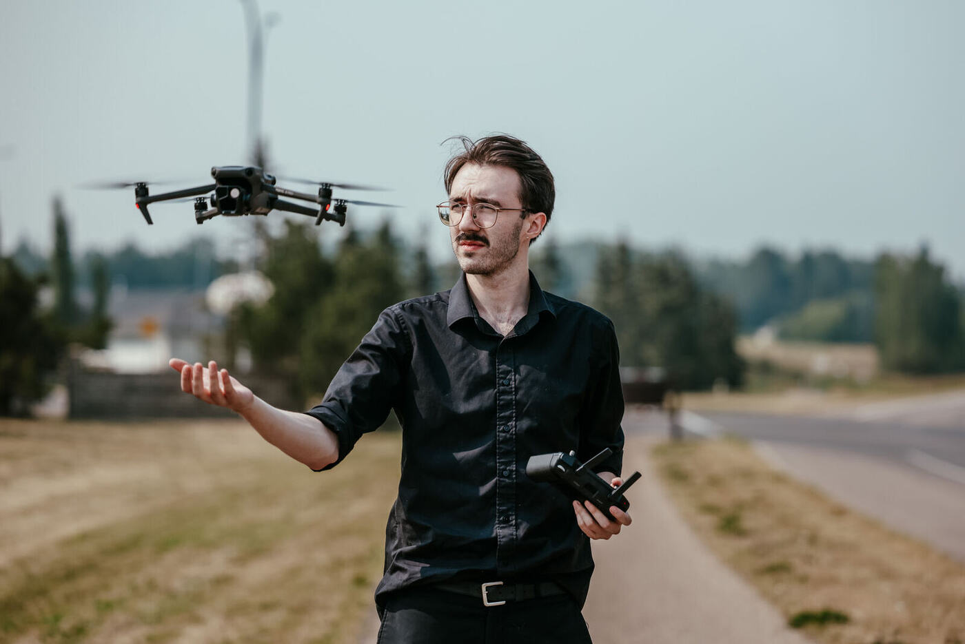 Flying Goose Media drone operator launching a drone on location